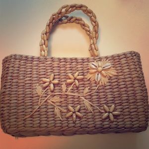 Wicker bag with beaded handles and flowers